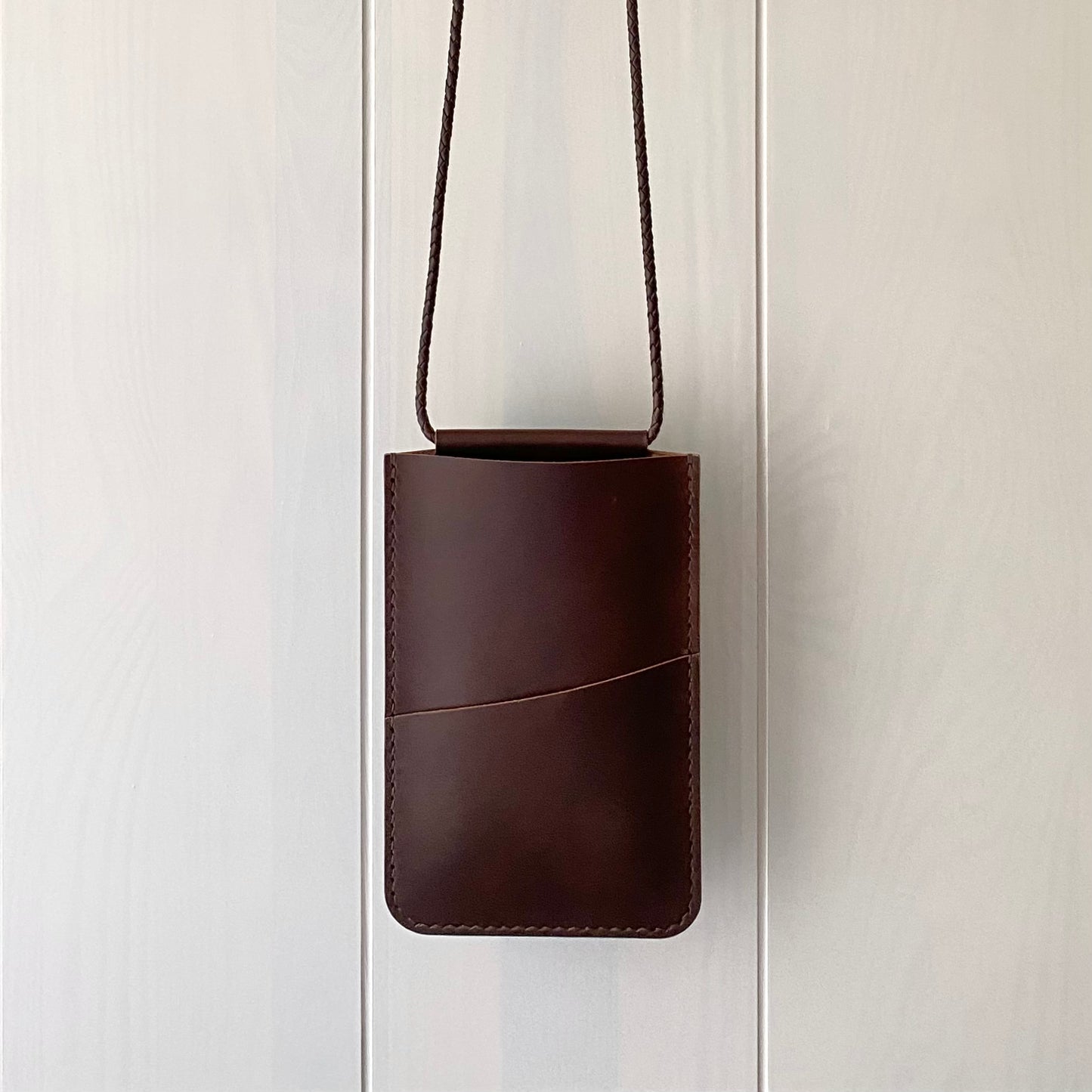 Leather phone sling bag in dark brown