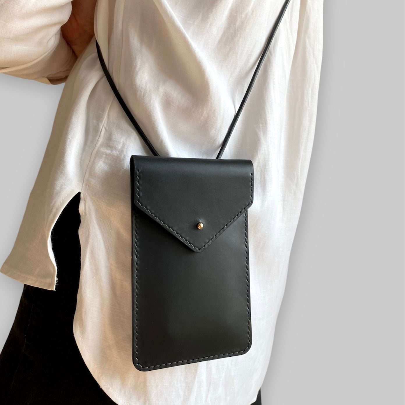 Leather phone sling bag in black